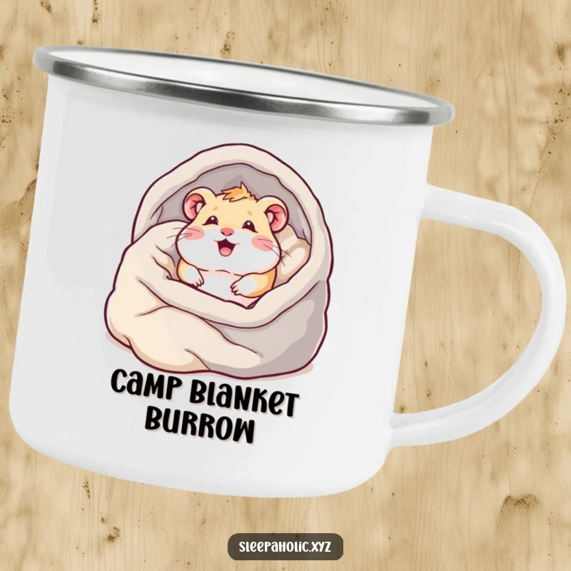 Funny hamster camping mug, depicting a content hamster burrowing into blankets, ideal for campers who love comfort.