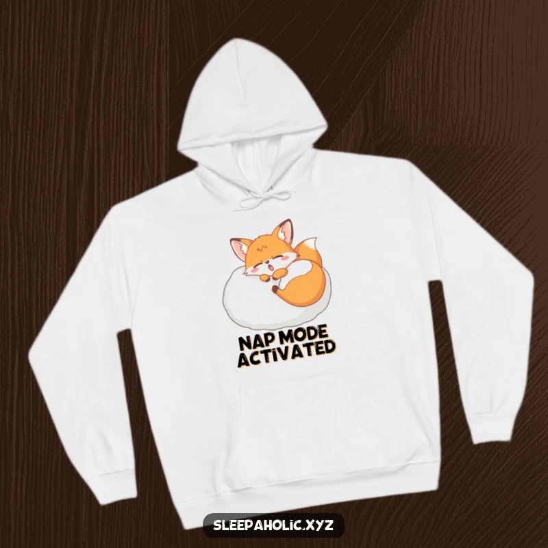 Funny yawning fox hoodie, showing a sleepy fox dozing on a giant pillow, perfect for maximum warmth and coziness.